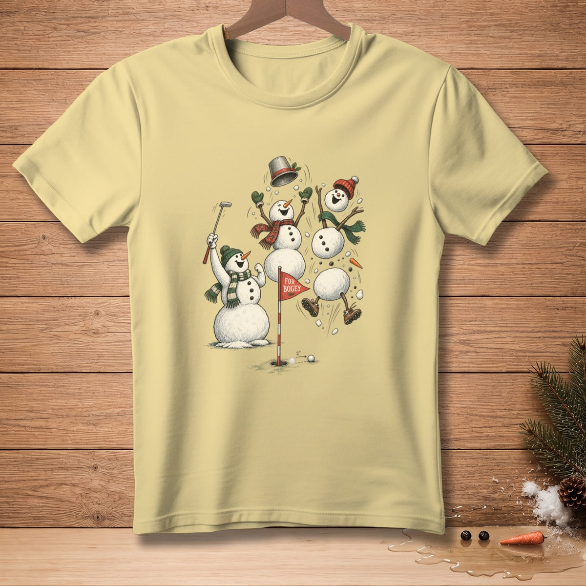 Snowmen playing golf on a cream t-shirt with a "FOR BOGEY" flag.