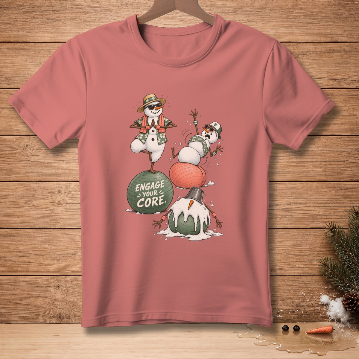 T-shirt with melting snowmen, yoga pose, and text "Engage Your Core."