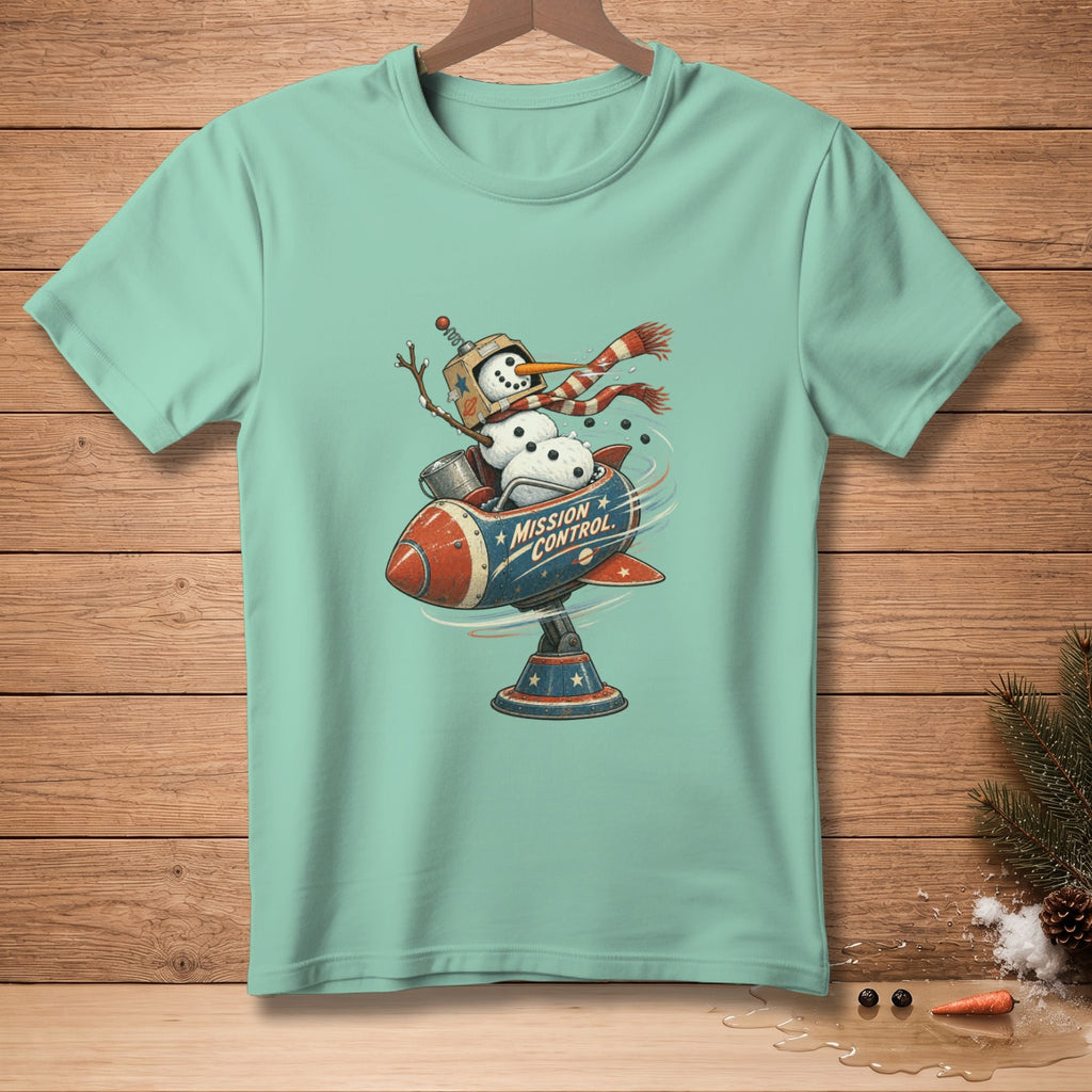 Snowman in a rocket ship with "MISSION CONTROL" text on teal t-shirt.
