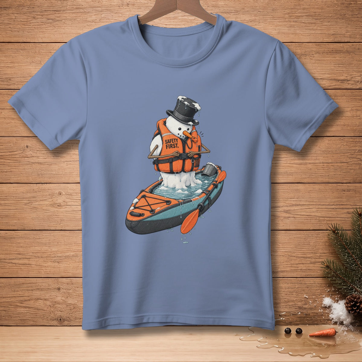 Snowman in a kayak wearing a life jacket with "Safety First" text.