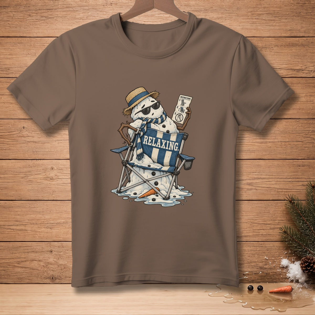 Melting snowman wearing sunglasses and hat relaxing in a chair, holding instructions.