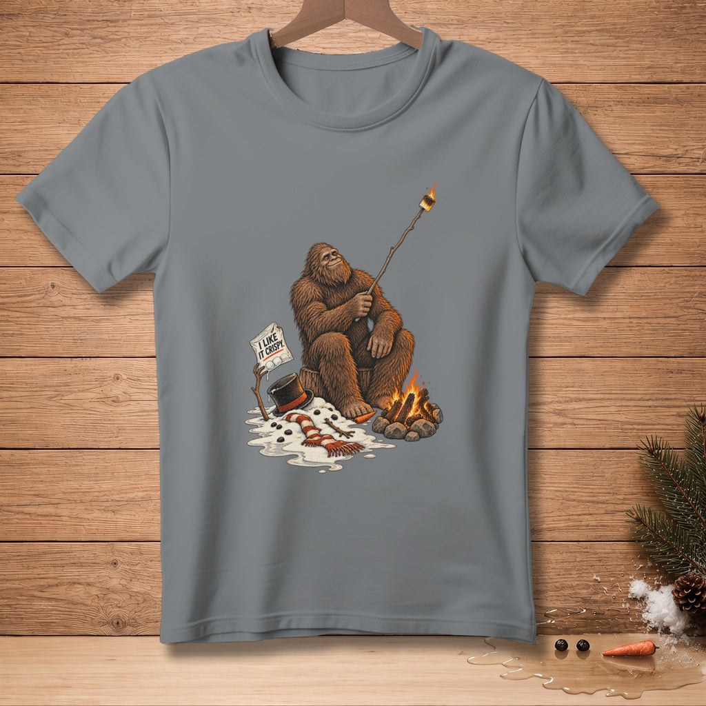 Bigfoot roasting a marshmallow over a campfire with text "I LIKE IT CRISPY".