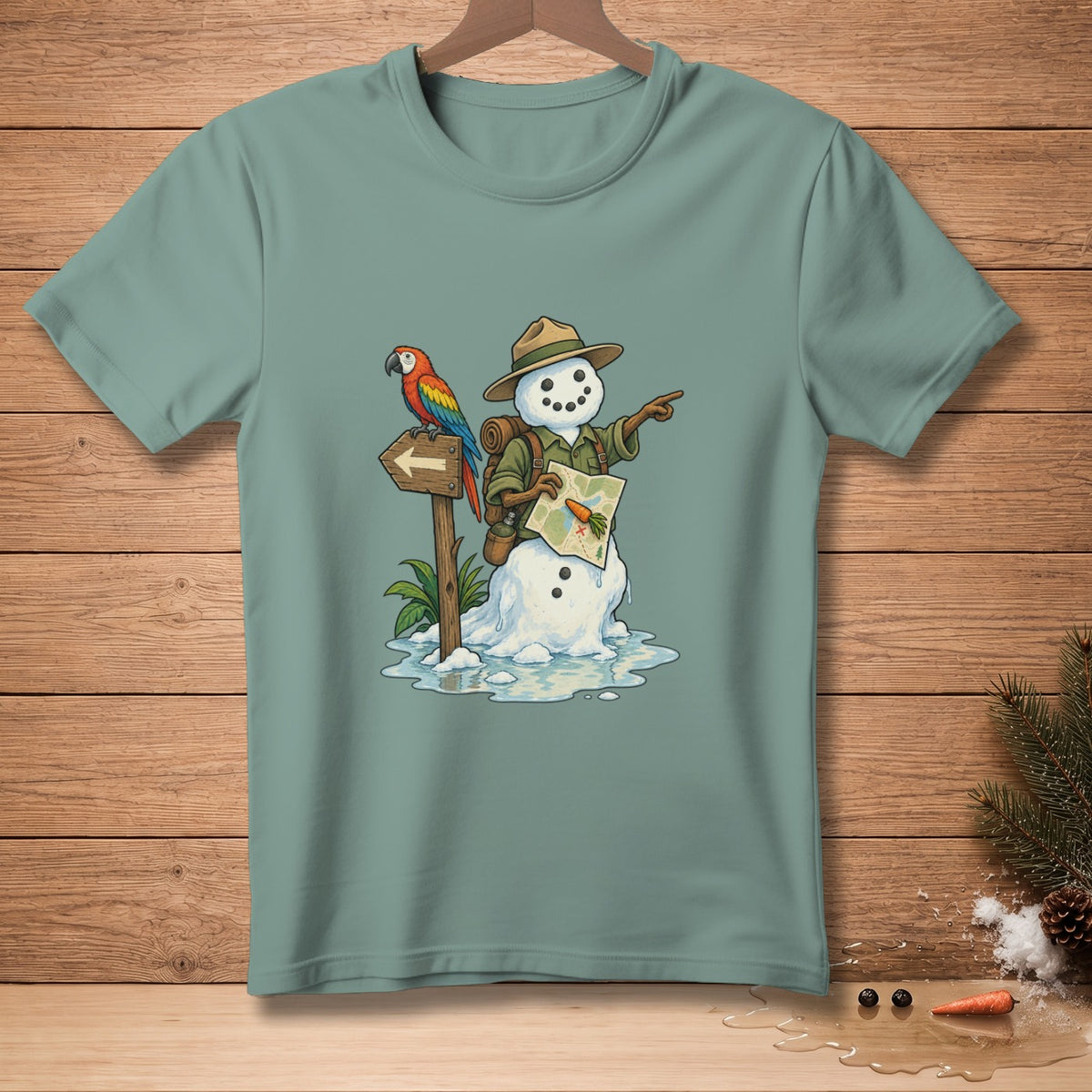Snowman in a hat with a parrot pointing a map, on a teal t-shirt.