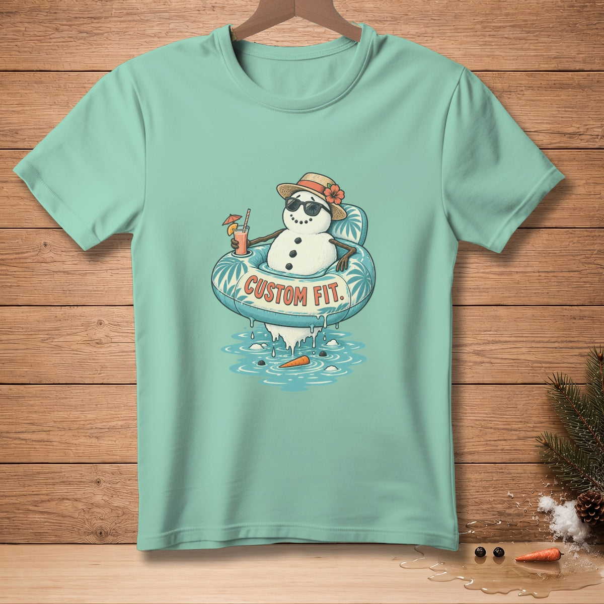 Mint t-shirt with snowman in inner tube and text "CUSTOM FIT".