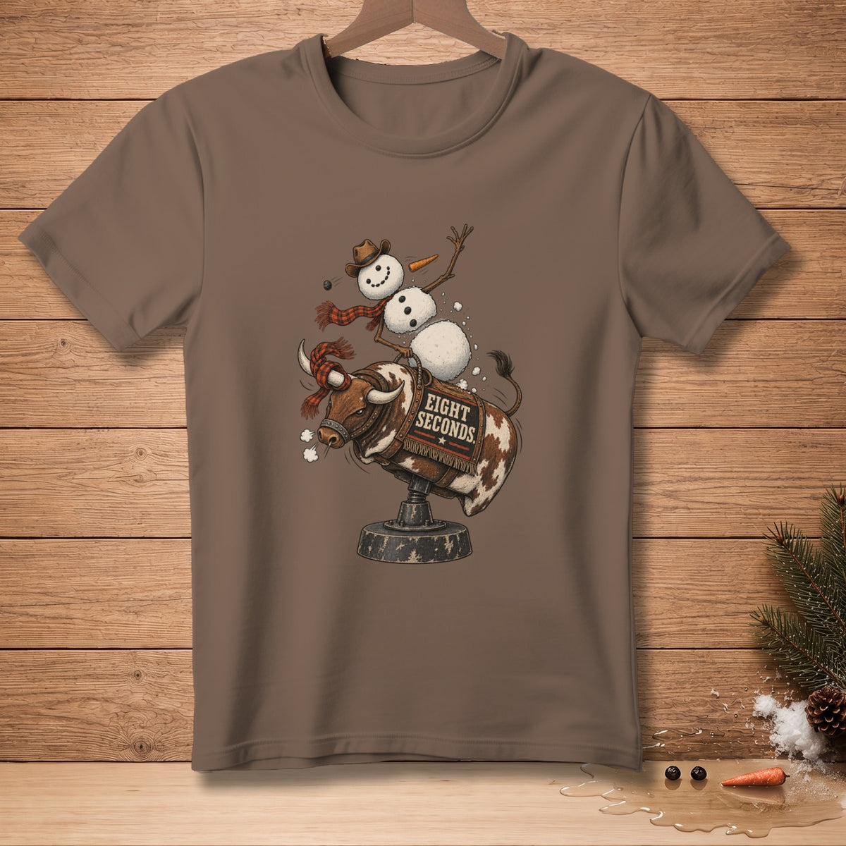 Snowman riding a bucking bull with "Eight Seconds" text on a brown t-shirt.