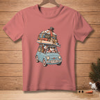 T-shirt with a graphic of snowmen packing a car with luggage, surfboards, and a hat.