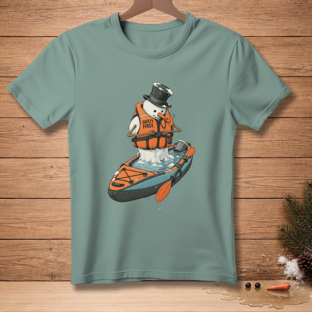 Snowman in a kayak wearing a life vest with "Safety First" text.