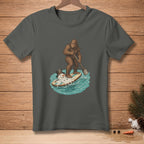 Bigfoot paddles a melting snowman on a surfboard through blue water.