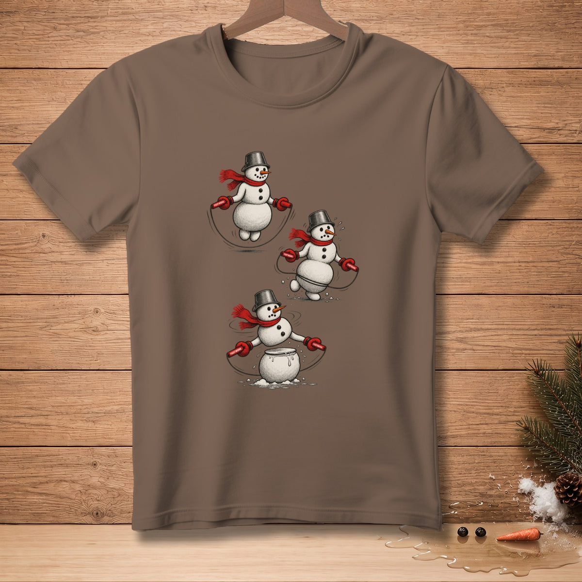 Brown t-shirt with cartoon snowmen jumping rope, one melting.