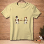 Snowmen reading at a table with a candle, on a pale yellow t-shirt.