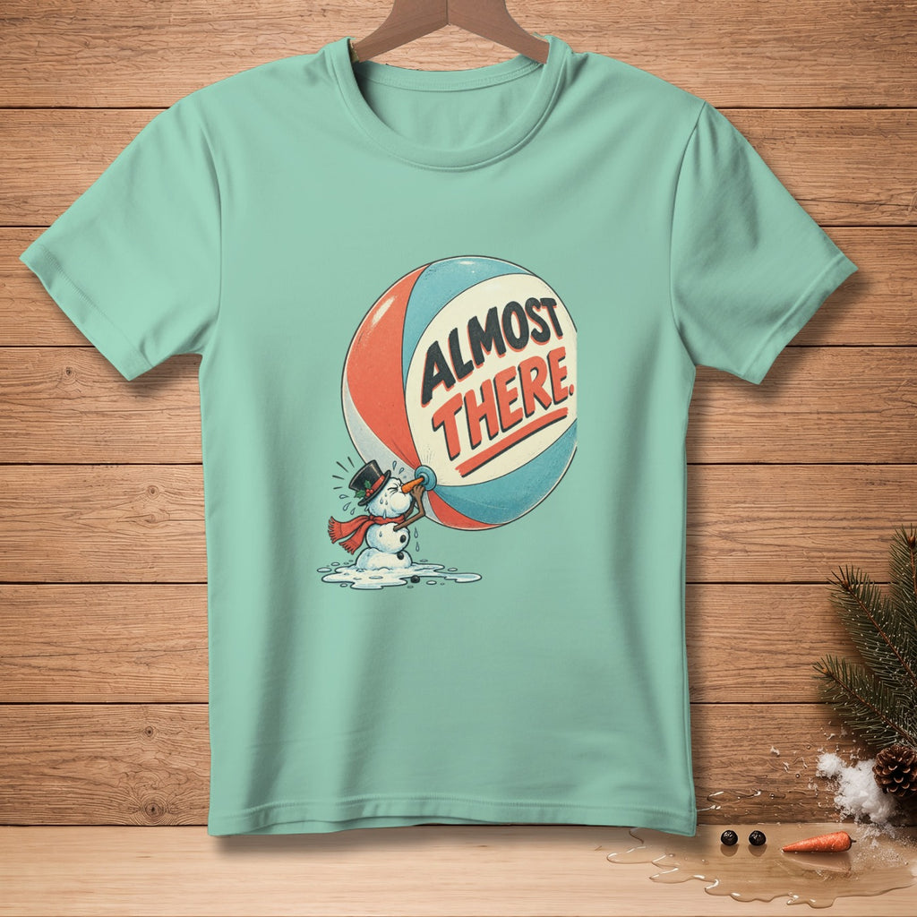 Mint t-shirt with melting snowman and "Almost There" text graphic.