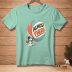Mint t-shirt with melting snowman and "Almost There" text graphic.