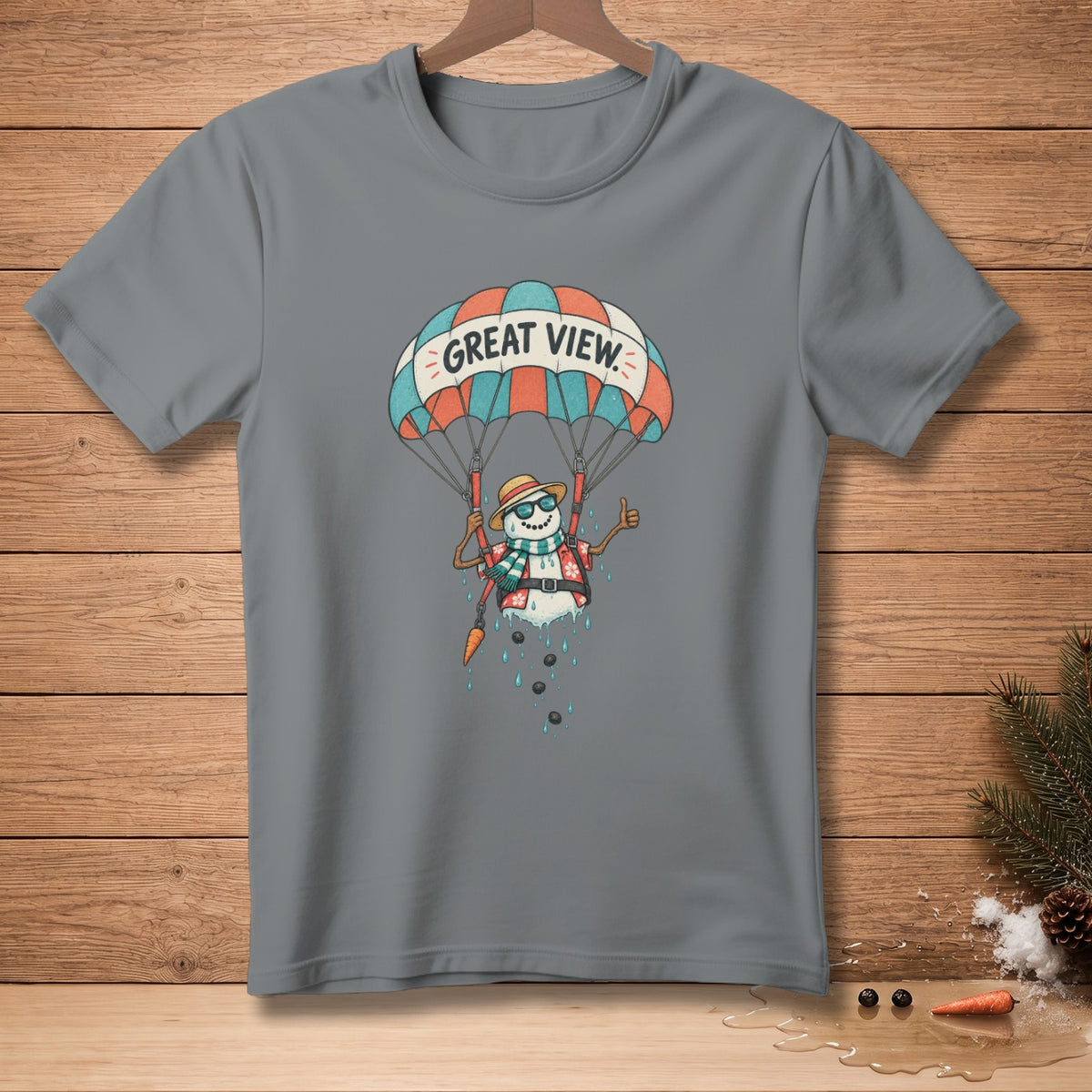 Gray t-shirt with a snowman parachuting under a banner reading "GREAT VIEW."