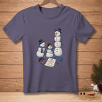 T-shirt with drawing of three snowmen, one tall and two smaller, surrounded by winter accessories.