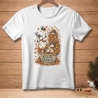 White t-shirt with snowmen in a bucket of leaves, text reads "MAKING PROGRESS."
