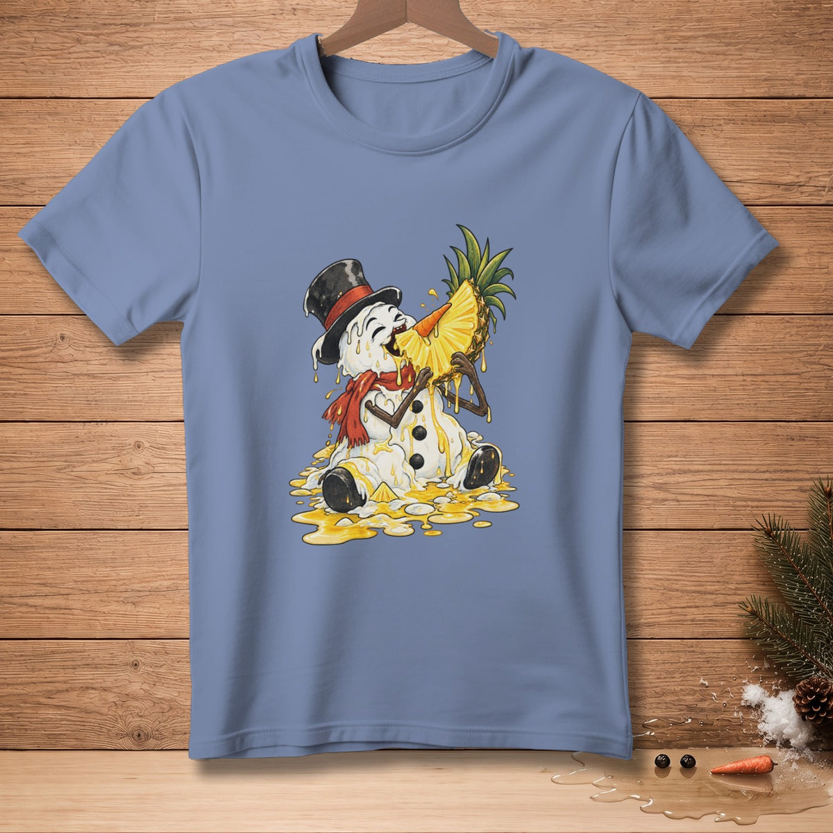 Melting snowman with pineapple slice on light blue t-shirt.