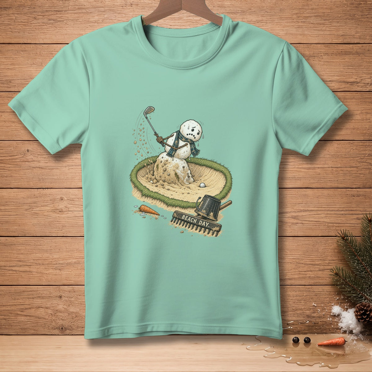 Snowman golfing in a sand trap with a golf club and a watering can labeled "BEACH DAY".