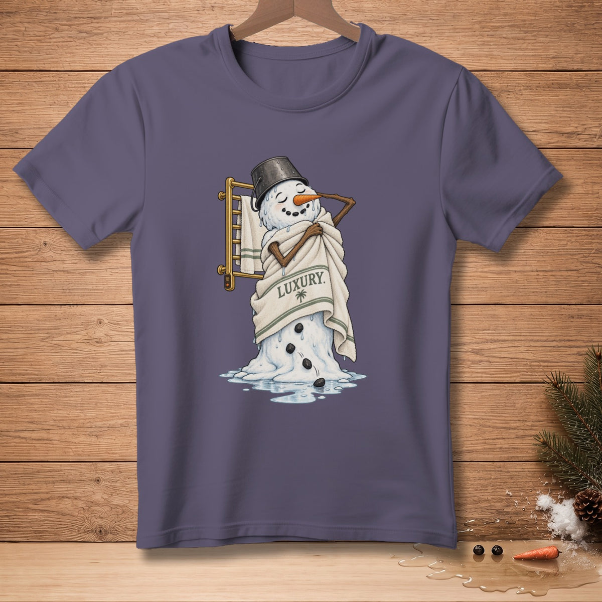 Snowman wrapped in towel with "LUXURY" text, standing in melted puddle.