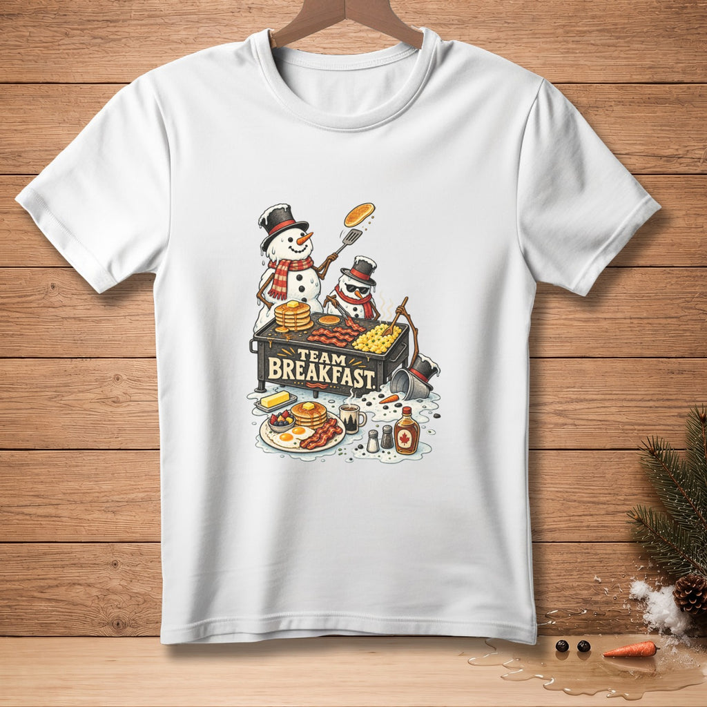 Snowmen cooking breakfast with "Team Breakfast" text on a white t-shirt.