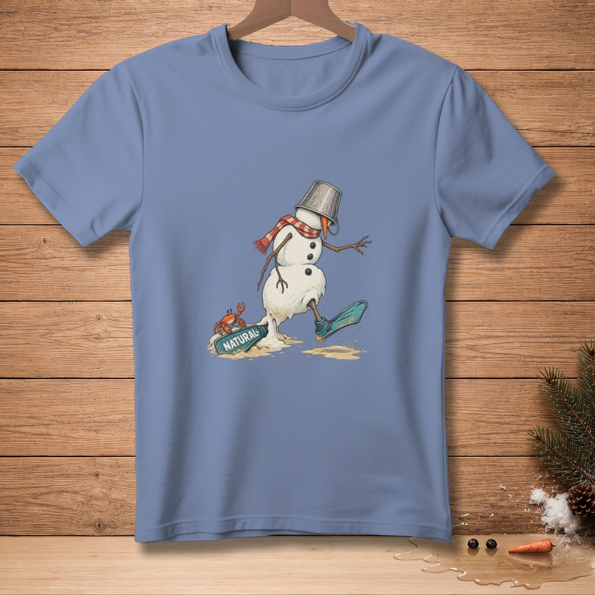 Melting snowman with bucket hat, scarf, and flipper on blue t-shirt.