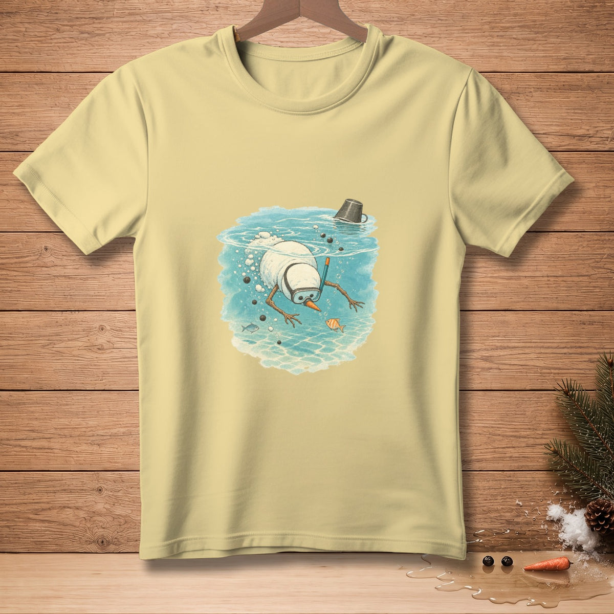 Light yellow t-shirt with a graphic of a snowman snorkeling underwater.