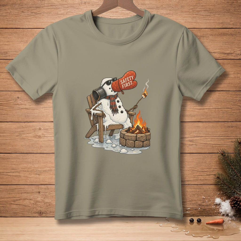 Snowman melting by campfire, wearing oven mitt with "Safety First."