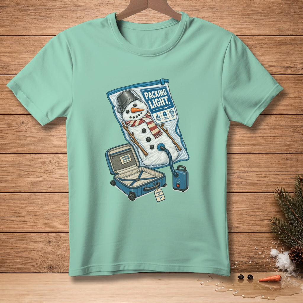 Snowman vacuum-sealed in a bag with a suitcase, text "PACKING LIGHT."