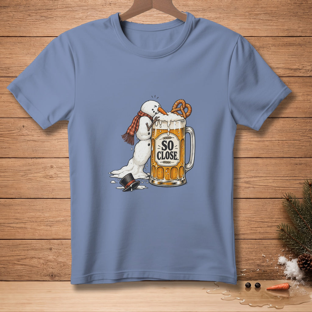 Melting snowman reaching for pretzel in beer mug, text "SO CLOSE."