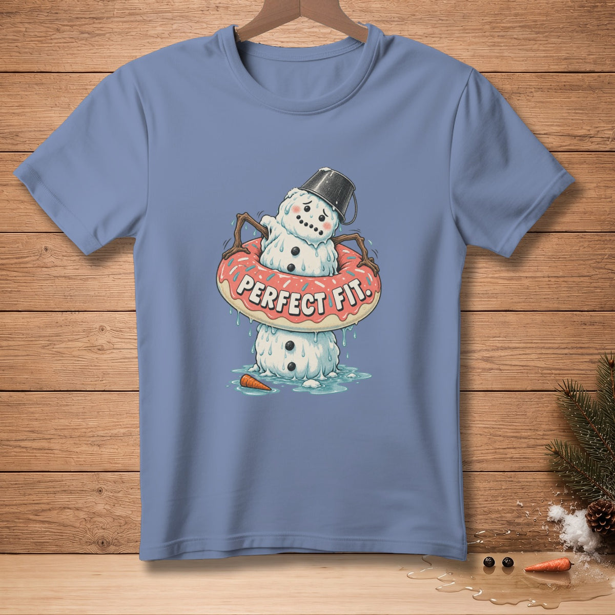 Melting snowman in a donut with text "PERFECT FIT" on a blue t-shirt.