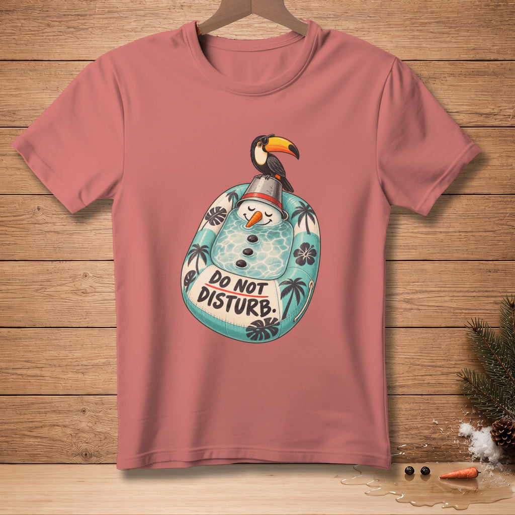 Pink t-shirt with a cartoon snowman on a pool float saying "Do Not Disturb".