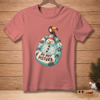 Pink t-shirt with a cartoon snowman on a pool float saying "Do Not Disturb".