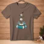 Snowman falling into inner tube with splashes of water, on brown t-shirt.