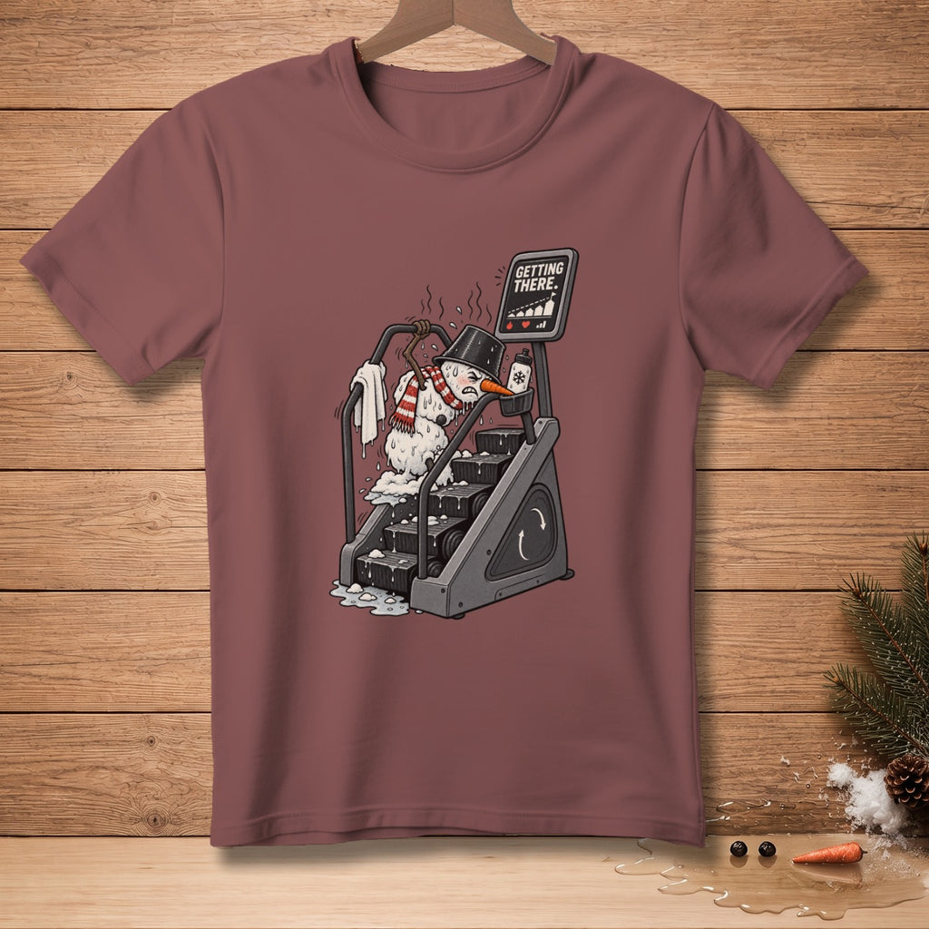 Melting snowman on a stair climber with "GETTING THERE." text.