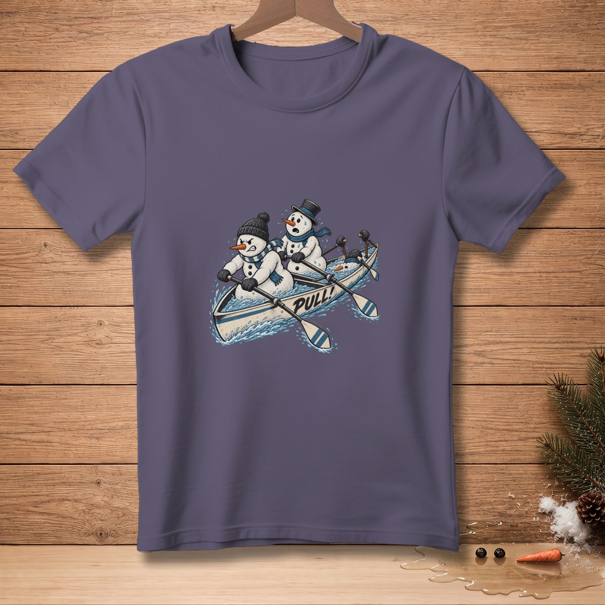 Snowmen rowing a boat with "PULL!" text on a purple t-shirt.