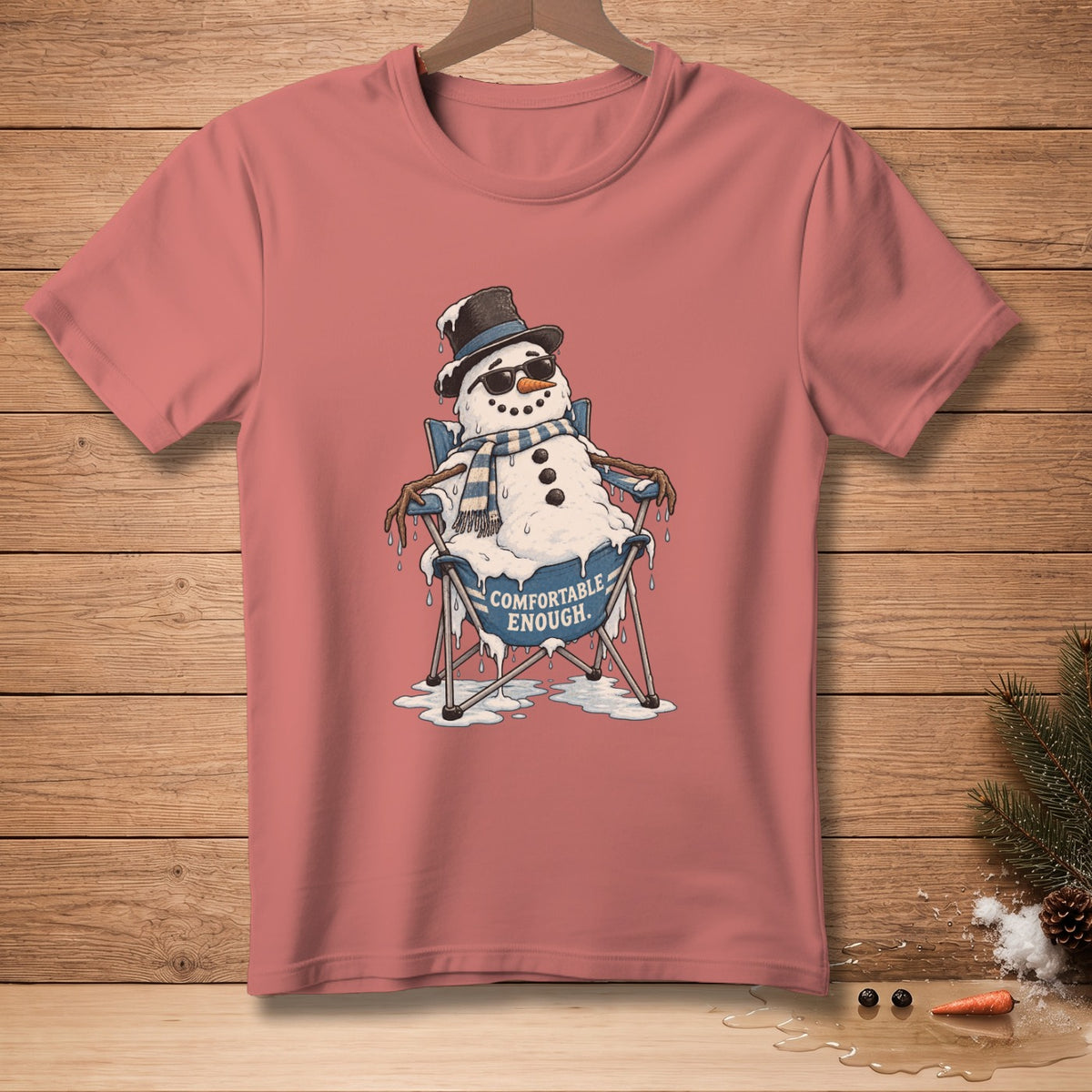 Melting snowman in sunglasses and hat sits in chair with "Comfortable Enough" text.