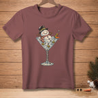 Snowman in martini glass with olives and text "Genius" on maroon t-shirt.