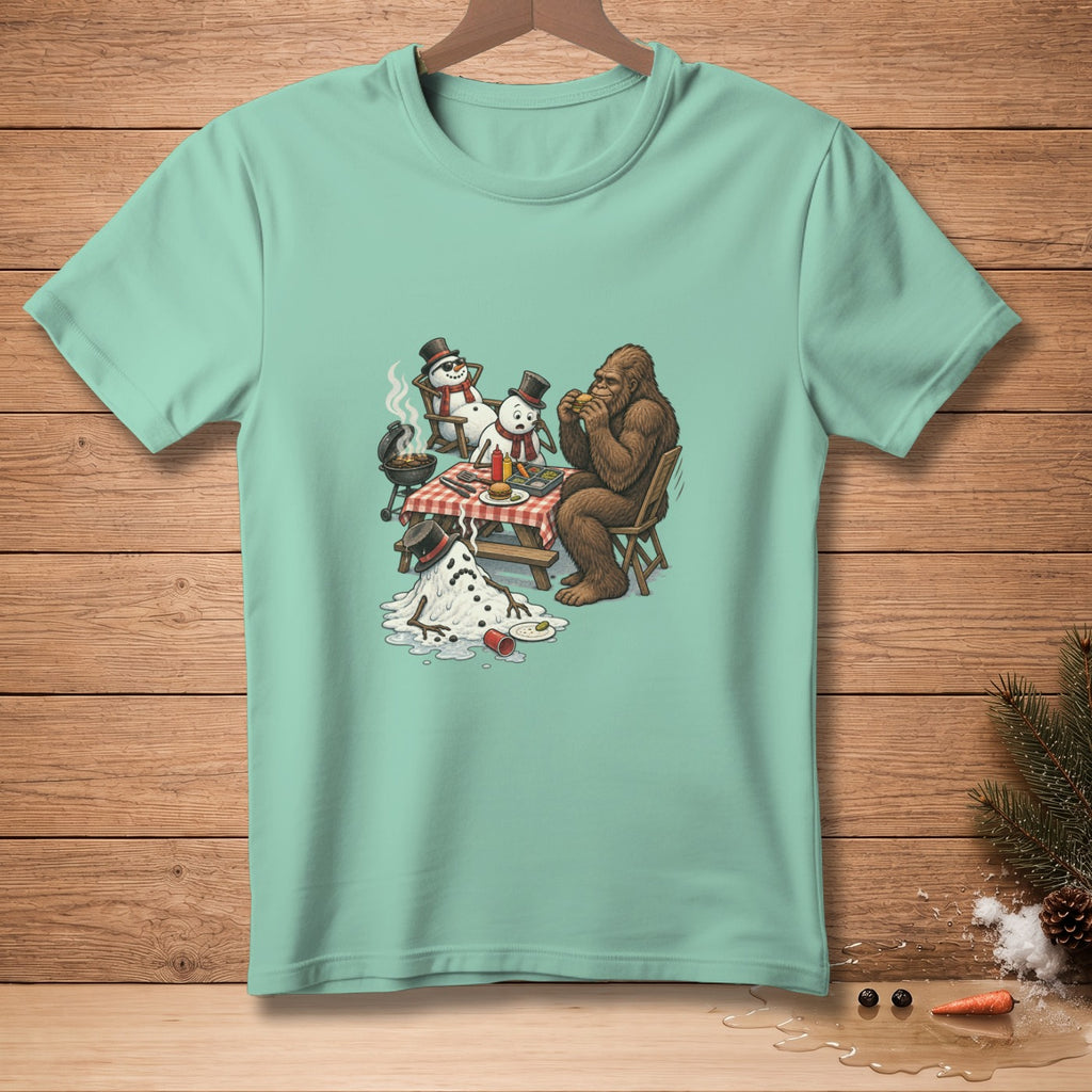 Bigfoot and snowmen at a picnic with a melting snowman and burgers.