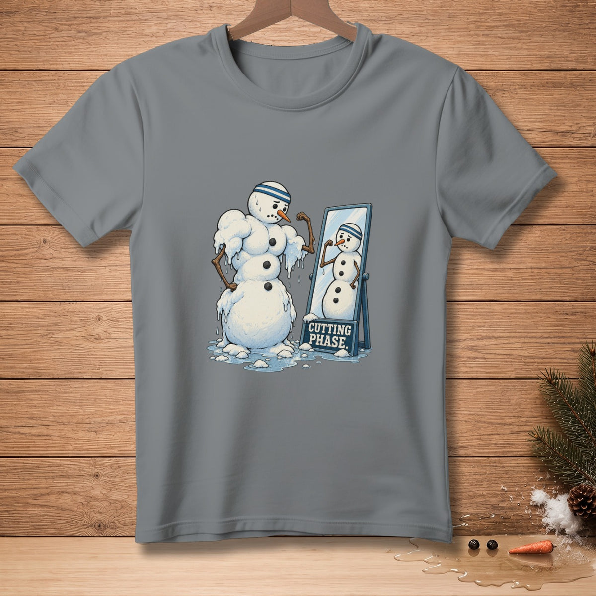 Snowman flexing in mirror with text "CUTTING PHASE" on a grey t-shirt.