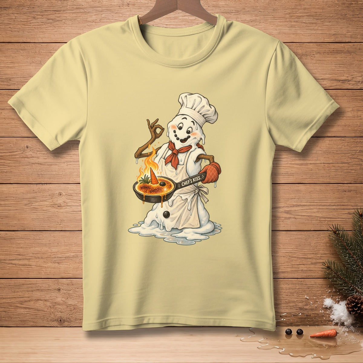 Snowman chef with a carrot and dessert, saying "Chef's Kiss."