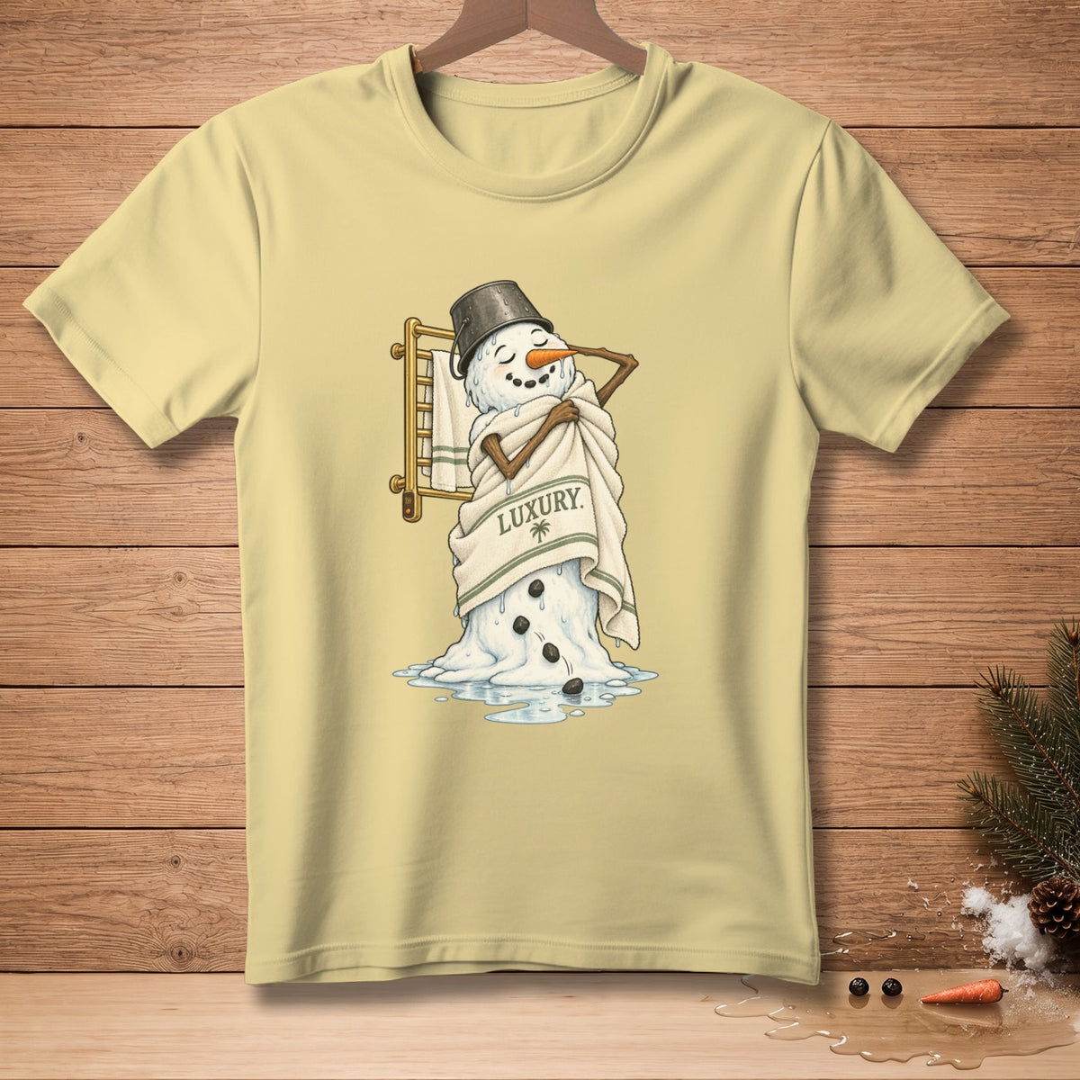 Snowman with bucket hat wrapped in towel that reads "LUXURY".