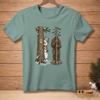 Snowman peeking from tree next to Bigfoot holding a sapling, "Nailed It." text.