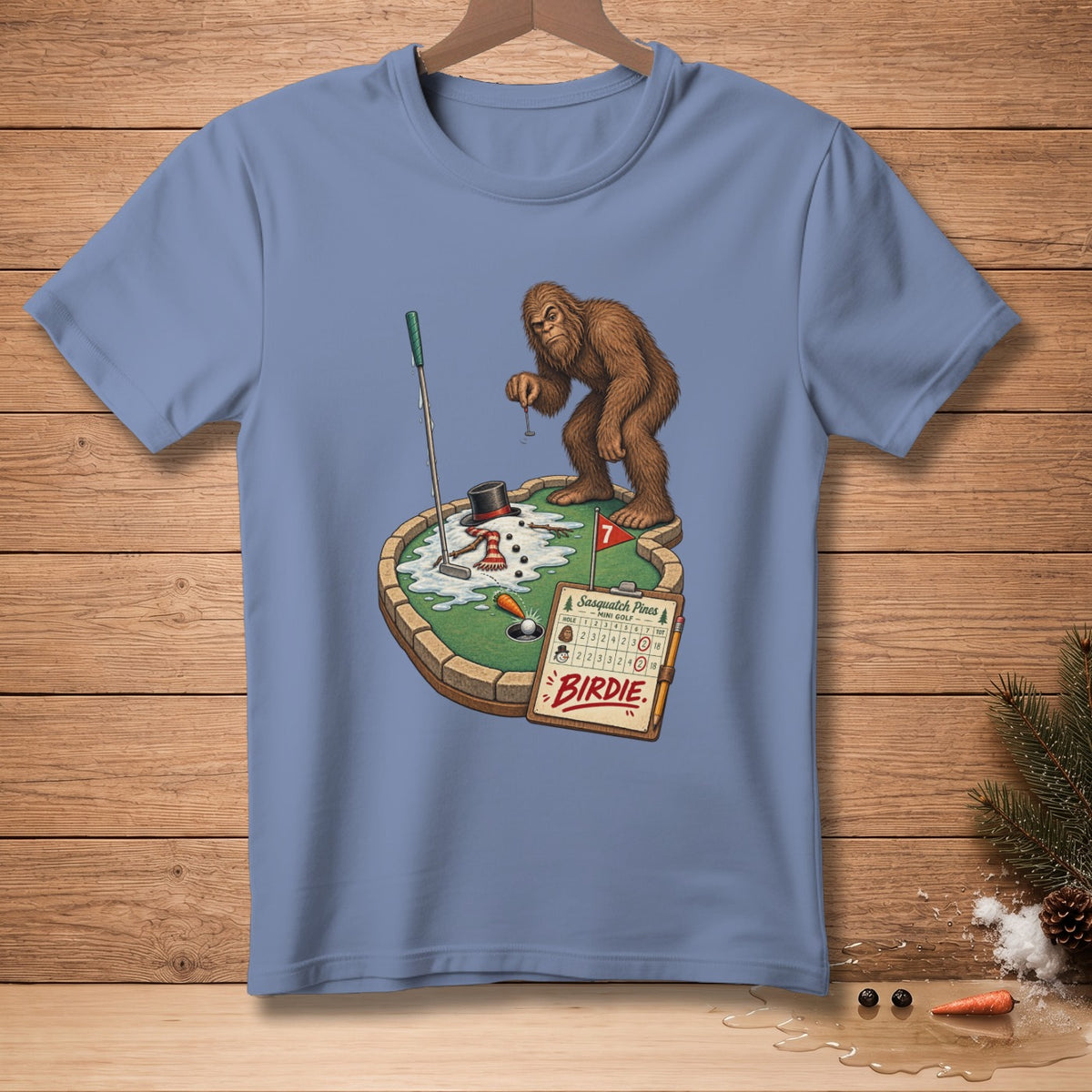 Bigfoot plays mini golf on a snowy course with a snowman and score card.