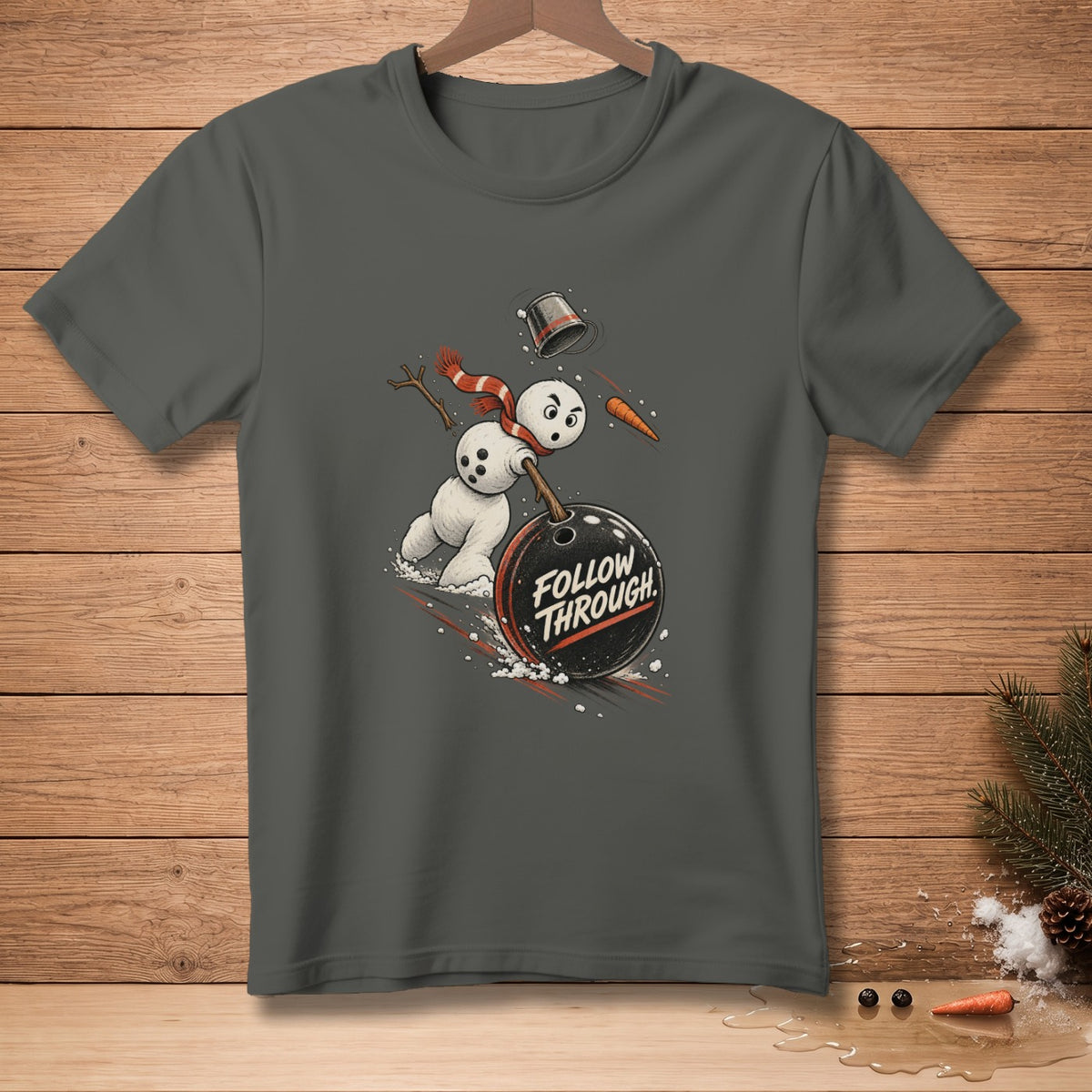 T-shirt graphic of a snowman bowling with text "FOLLOW THROUGH".