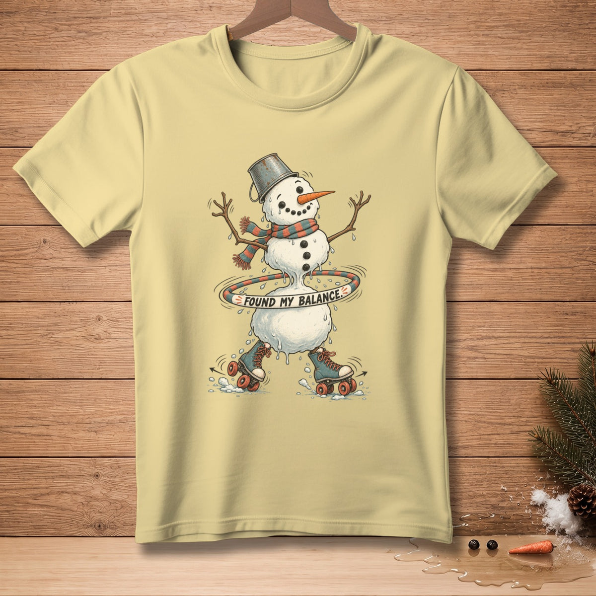 Yellow t-shirt with melting snowman on roller skates saying "Found My Balance".