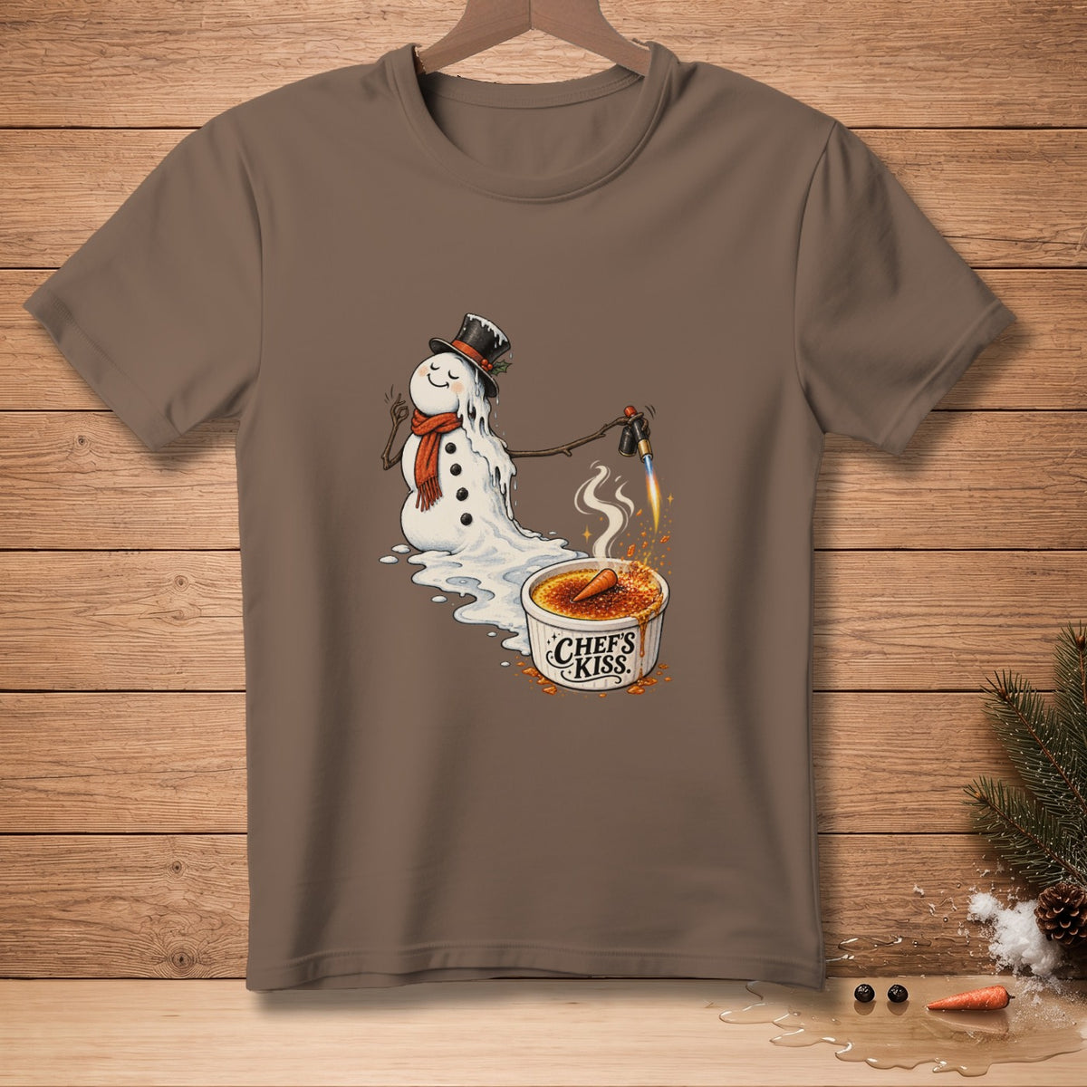 Melting snowman with torch caramelizing crème brûlée with "Chef's Kiss" text.