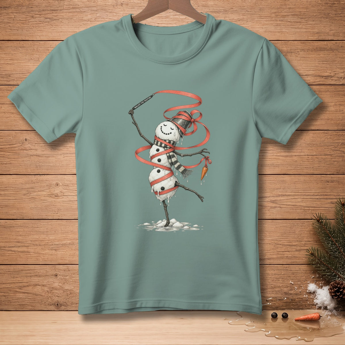Melting snowman with carrot nose dancing with red ribbon and text "NAILED THE ROUTINE".