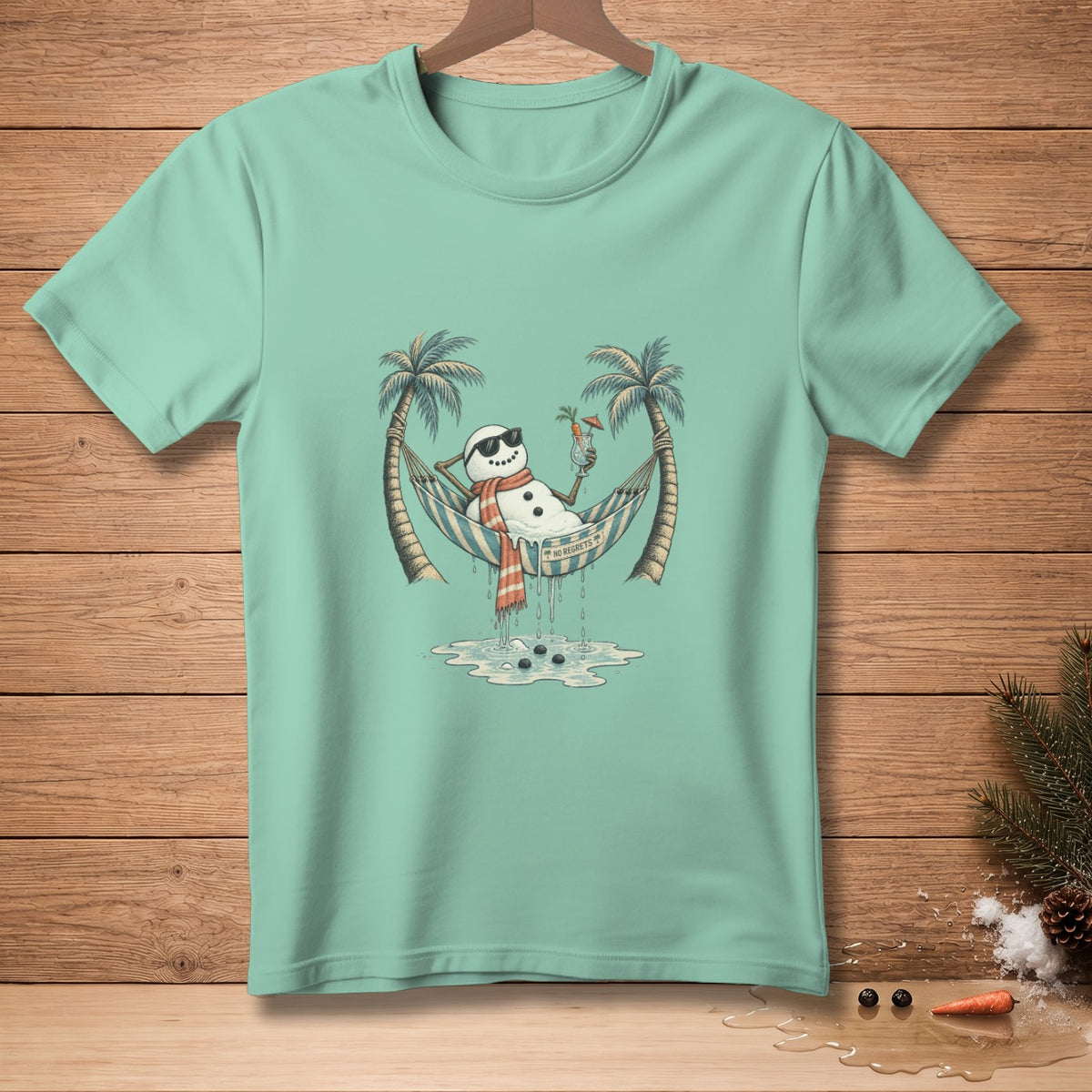 Melting snowman in hammock with sunglasses, holding a drink, "No Regrets" text.