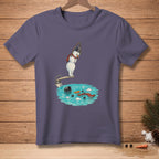 T-shirt with a snowman on a diving board over a pool with carrot, scarf, and snowball debris.