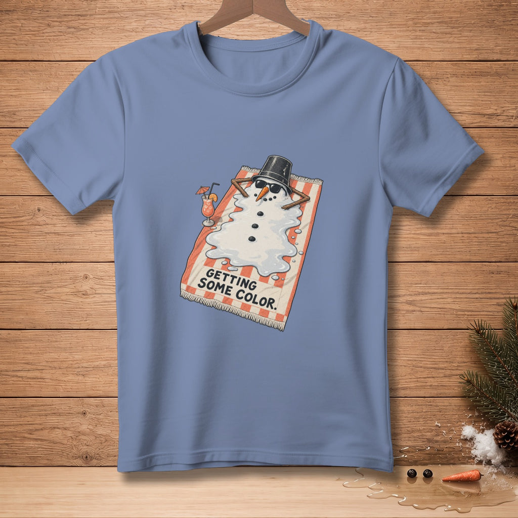 Melting snowman on striped towel, drinking cocktail, says "GETTING SOME COLOR."