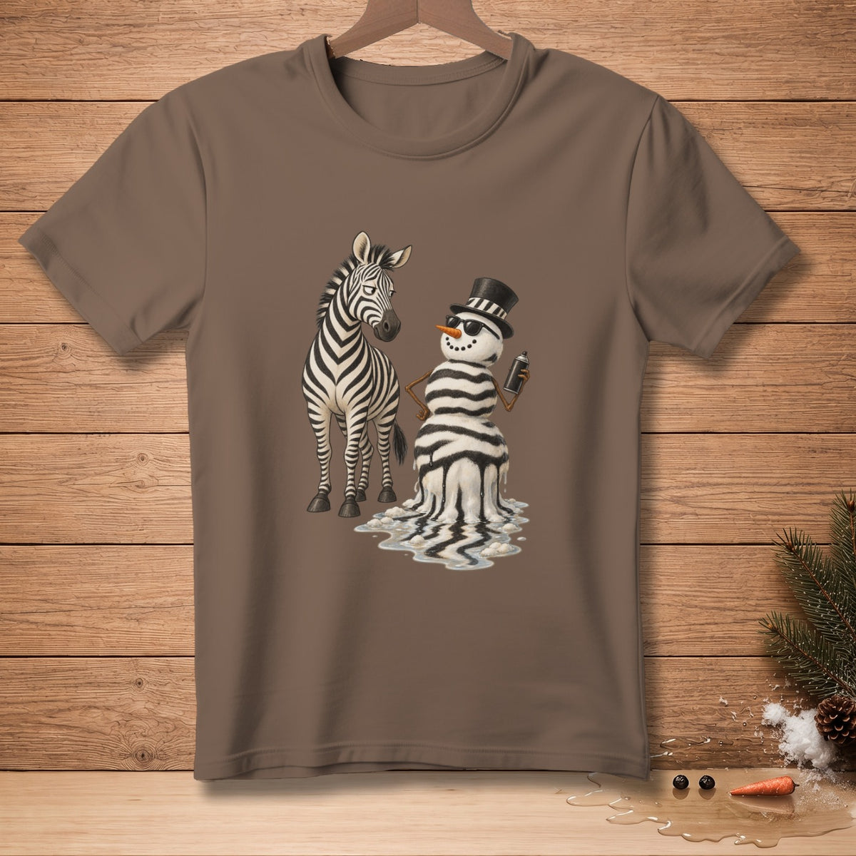 Brown t-shirt with a zebra next to a melting, striped snowman holding a can of spray paint.